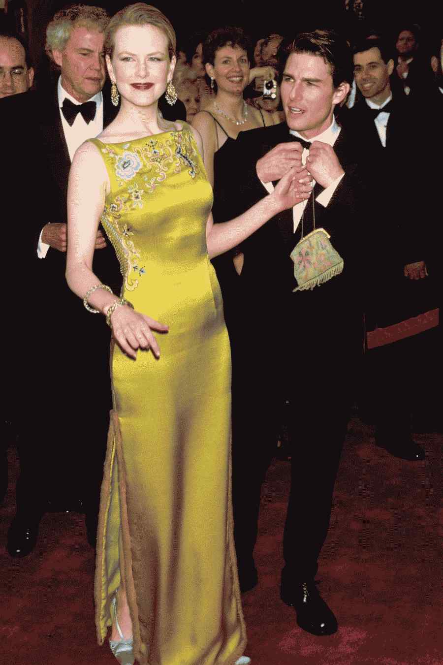 A imagem pode conter Tom Cruise Estreia da moda da pessoa humana Terno Casaco Vestuário Sobretudo Vestuário e Nicole Kidman