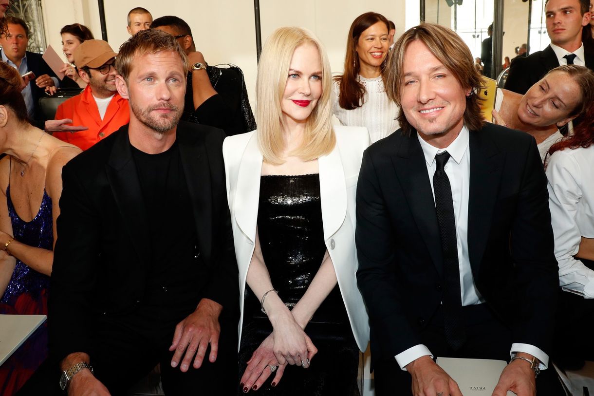 Nicole Kidman satt precis mellan två av hennes män på en modevisning